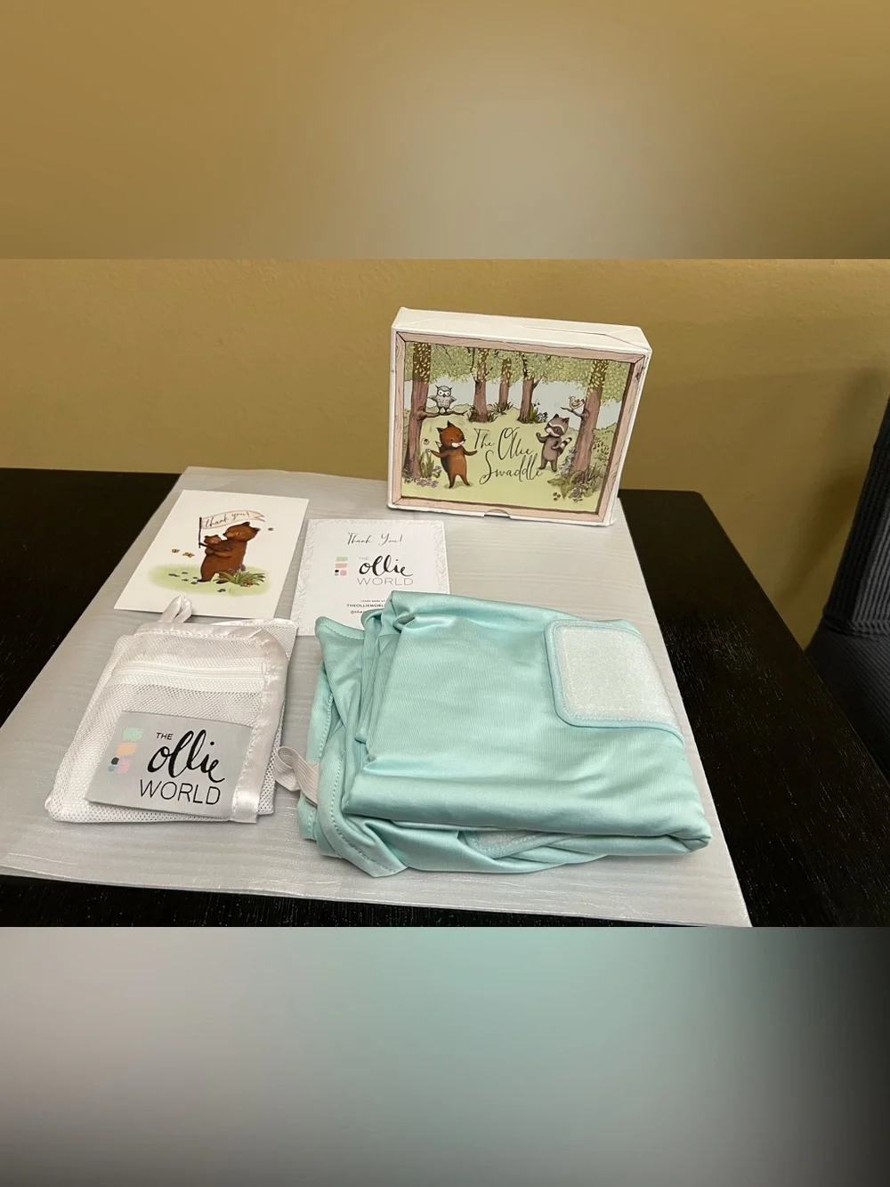The Ollie Adjustable Swaddle For Newborns. Color: Sky. NEW IN OPEN BOX